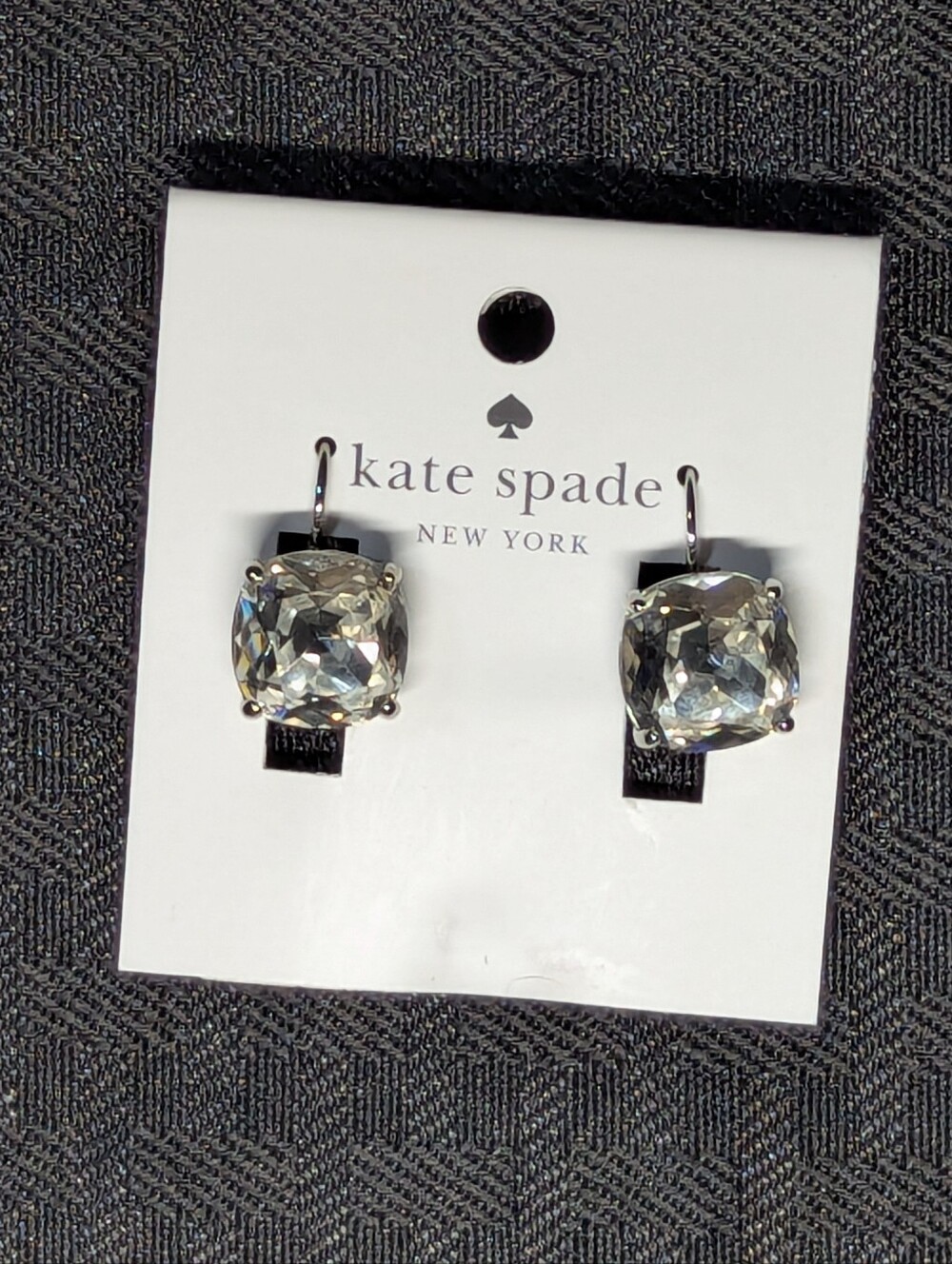 Silver Kate Spade Crystal cushion drop earrings.